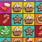 Renkli karelerle dolu bir ızgarada zencefilli kurabiye, yılbaşı çorabı, şeker kamışı, yıldız ve yılbaşı pastası şekilleri