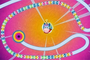 Renkli bir zincir ve ortasında sevimli karakter olan pembe ve turuncu bir arka plan üzerinde dolanan yol