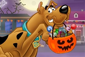 Scooby Doo, ağzında balkabağı şeklinde şeker dolu bir sepet tutuyor, arka planda dolunay ve süslemeli evler görülüyor