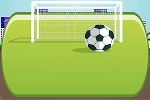 Yeşil sahada kale önünde duran bir futbol topu