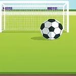 Yeşil sahada kale önünde duran bir futbol topu